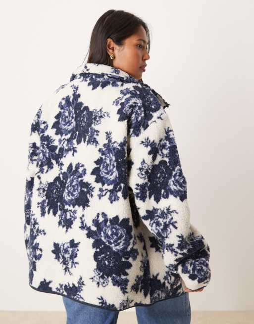 ASOS DESIGN Curve zip up borg fleece in navy and cream floral design