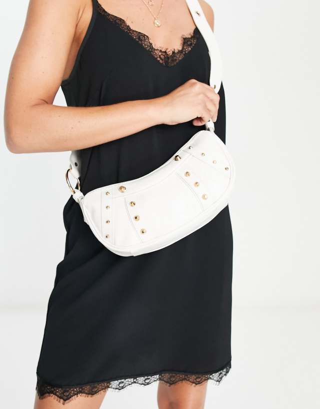 ASOS DESIGN curved crossbody with studding in white