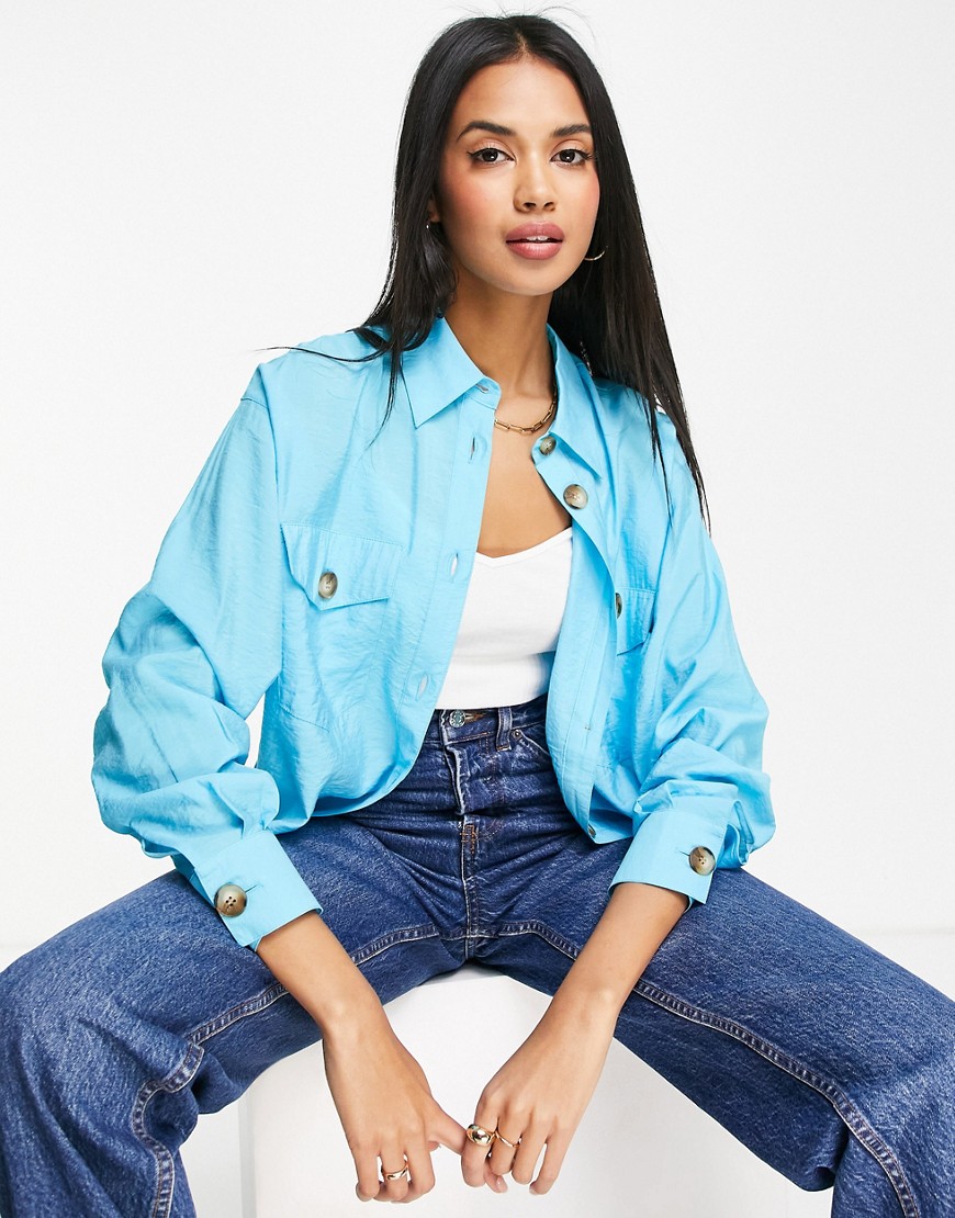 ASOS DESIGN curved hem shirt with pockets and horn buttons in bright blue-Multi