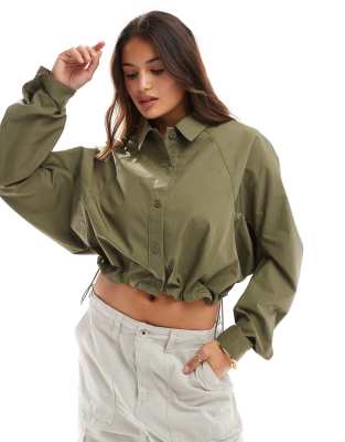 ASOS DESIGN curved hem toggle utility shirt in khaki-Green