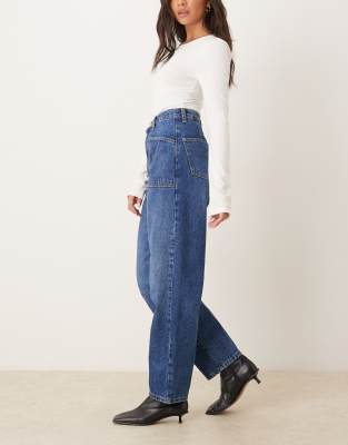 Asos Design Curved Leg Jeans In Blue
