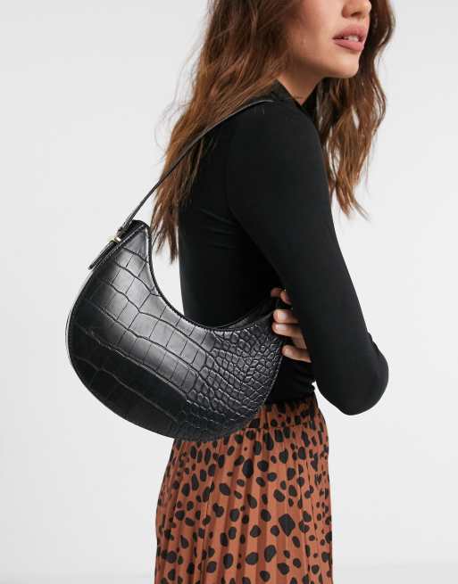 ASOS DESIGN leather curved base crossbody sling bag with contrast stitch in  black