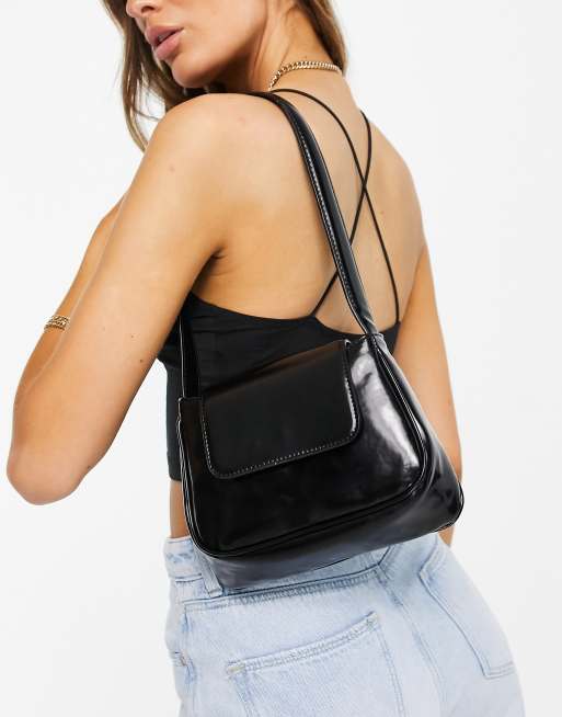 ASOS DESIGN curved shoulder bag with flap in black