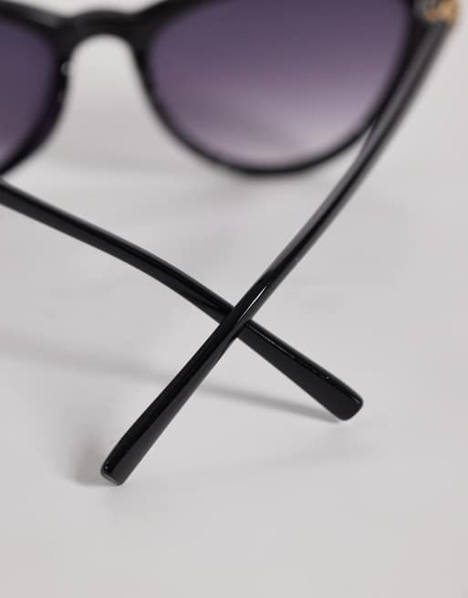 ASOS DESIGN curved slim cat eye sunglasses in black, 2 of 3