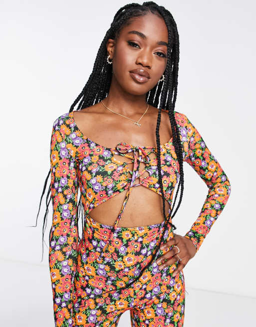 ASOS DESIGN cut-out lace-up jumpsuit in floral print