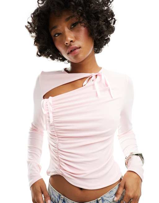 ASOS DESIGN cut out long sleeve top with bow detail in pink