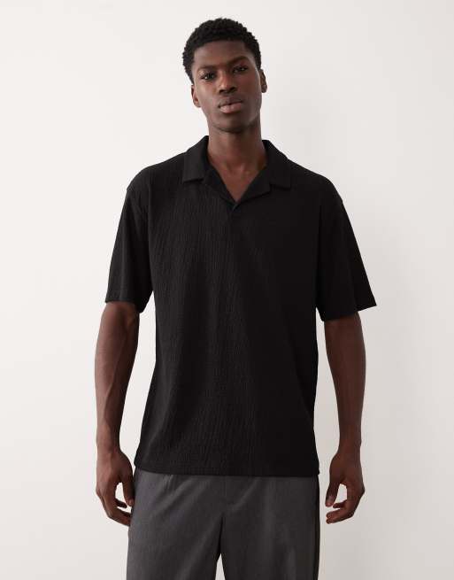 ASOS DESIGN – Czarna gruba koszulka polo o luźnym kroju z gniecionego prążkowanego materiału