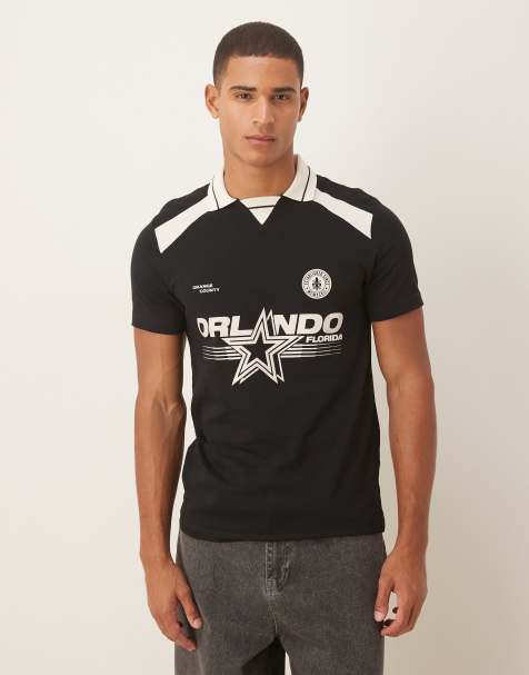 ASOS DESIGN polo with city graphic in black