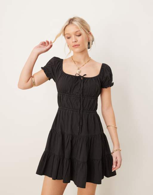 ASOS DESIGN – Czarna luźna sukienka warstwowa mini z miękkiego jeansu z wiązaniem