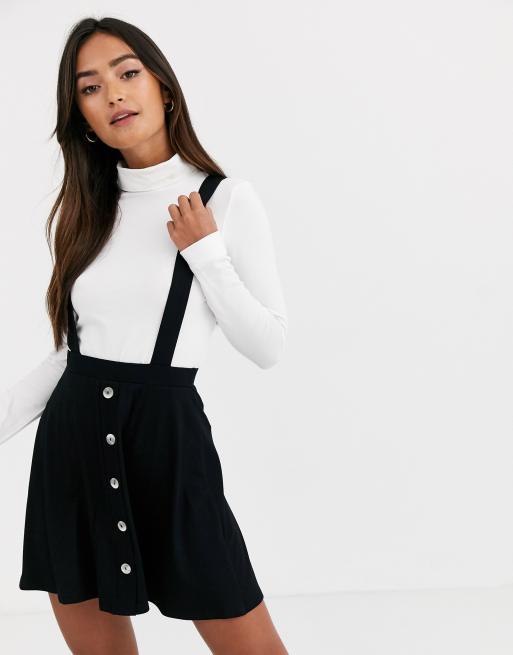 ASOS DESIGN – Czarna spódnica mini na szelkach o fasonie ogrodniczki na guziki z przodu
