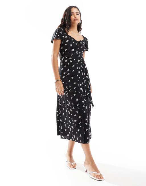 ASOS DESIGN – Czarna sukienka midi z zapięciem na guziki i wiązaniem w drobny kwiatowy wzór