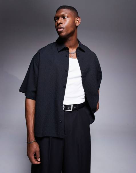 ASOS DESIGN boxy oversized textured shirt with press studs in black