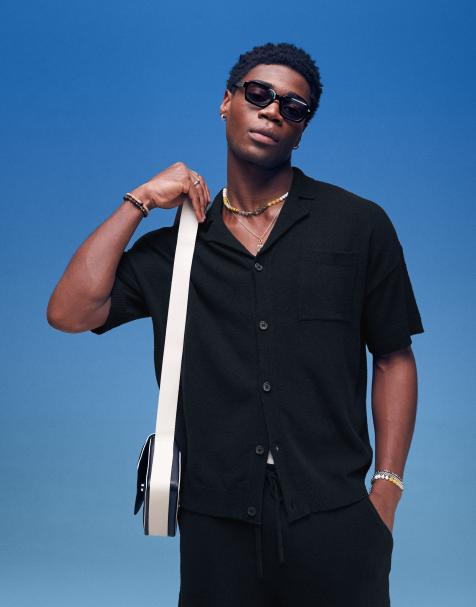 ASOS DESIGN oversized  fit lightweight textured button through polo co-ord in black 