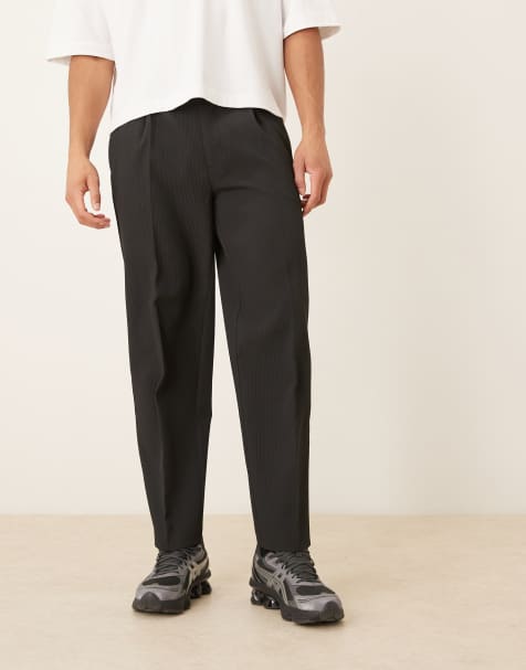 ASOS DESIGN – Czarne fakturowane dopasowane spodnie oversize ze zwężanymi nogawkami z zakładkami - view 1