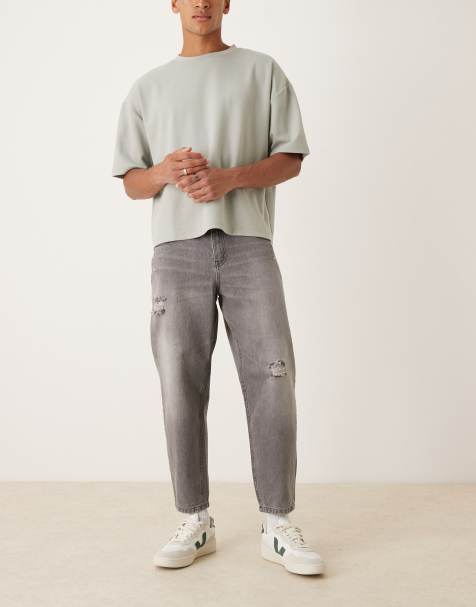 ASOS DESIGN relaxed tapered jeans in washed black with rips