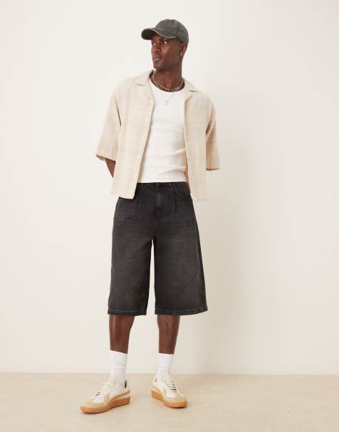 ASOS DESIGN – Czarne sprane wydłużone jeansowe jortsy z zakładkami - view 1