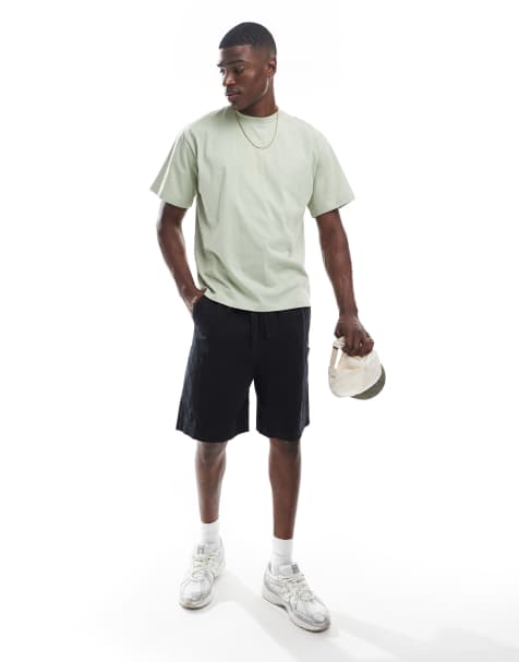 ASOS DESIGN mid length cargo shorts with patch detail in black