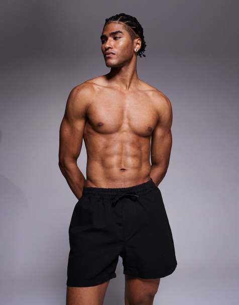 ASOS DESIGN swim shorts in short length in black