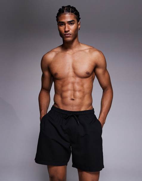ASOS DESIGN swim shorts in mid length in black