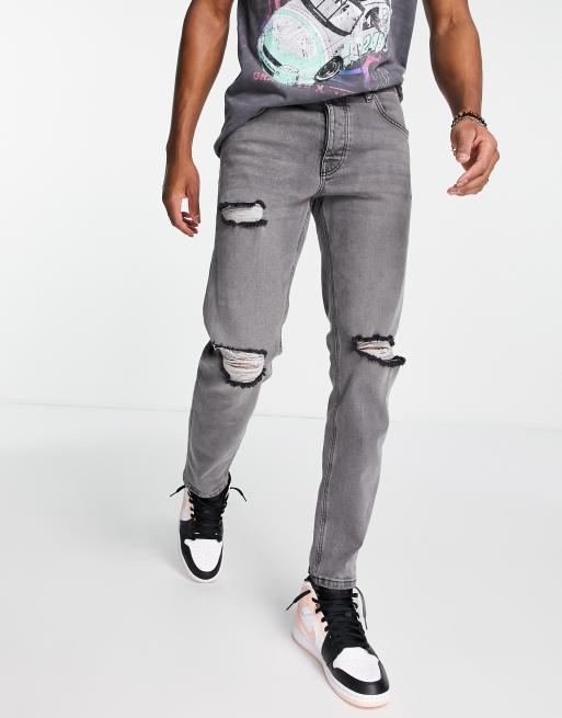 ASOS DESIGN – Czarne zwężane jeansy z efektem sprania i przedarciami na kolanach