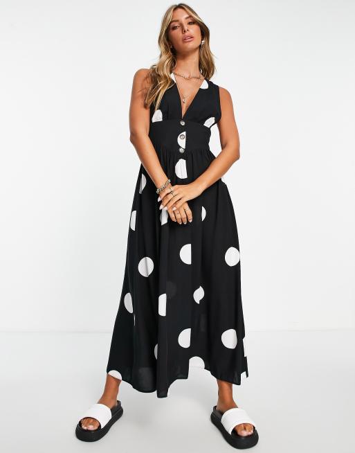 ASOS DESIGN – Czarno-biała sukienka midi w stylu ogrodniczek z głębokim dekoltem i wzorem w groszki