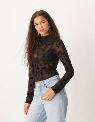 ASOS DESIGN – Czarny prześwitujący top z zabudowanym dekoltem, długimi rękawami i marszczeniem we flokowany kwiatowy wzór