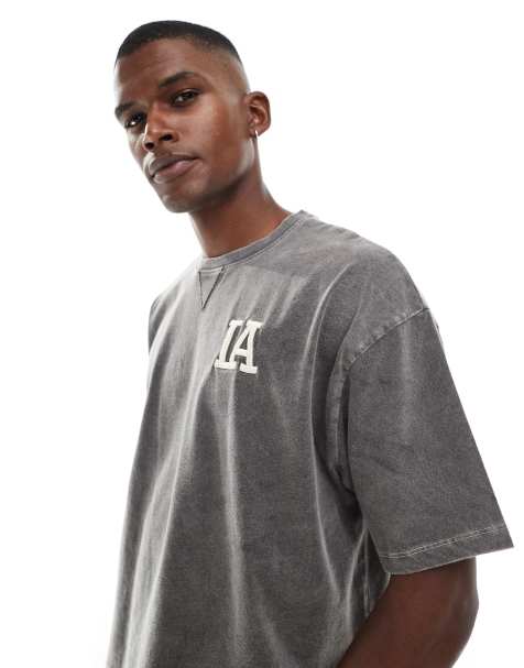 ASOS DESIGN – Czarny pudełkowy T-shirt oversize z grafiką z nazwą miasta i efektem sprania - view 1