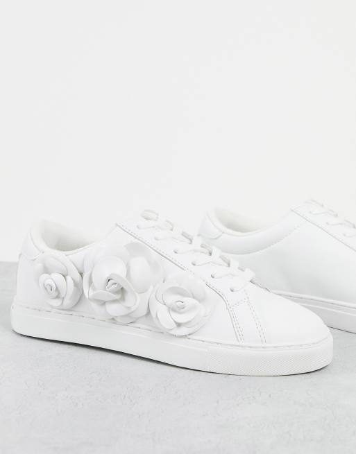 White shoes store with flowers