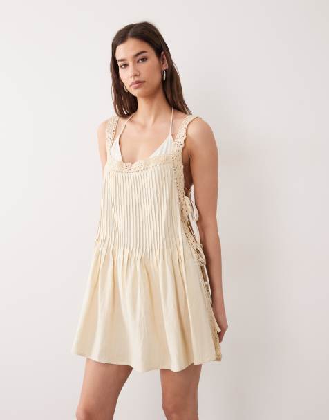 ASOS DESIGN – Daisy – Plissiertes Strand-Sommerkleid aus Spitze in Buttermilchgelb - view 1