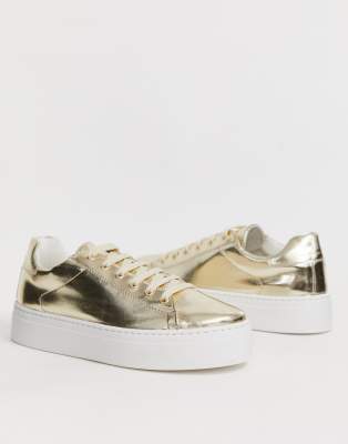 gold flatform trainers