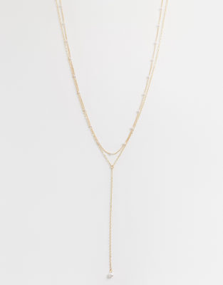 ASOS DESIGN delicate lariat necklace with station faux-pearl detail in gold tone
