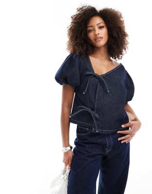 denim asymmetric tie side top in mid blue