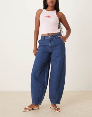 denim barrel jeans with darted hem in mid blue