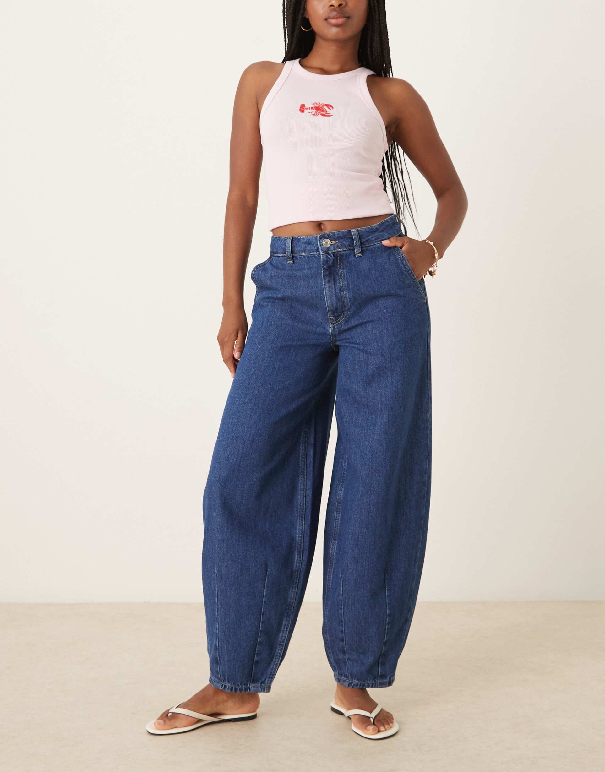 asos design denim barrel jeans with darted hem in mid blue