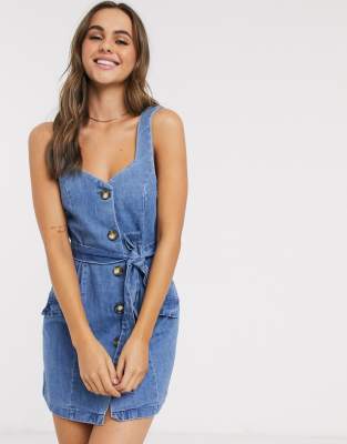 ASOS DESIGN denim button pinafore mini dress in blue | ASOS