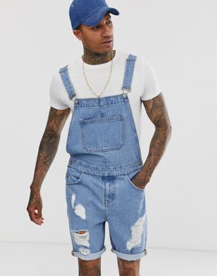 ASOS DESIGN denim dungaree shorts in light wash with heavy rips | ASOS