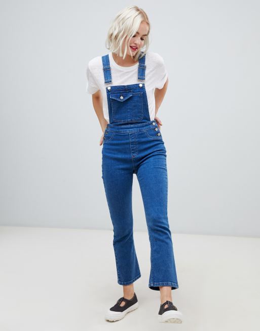 ASOS DESIGN denim dungaree with kickflare in midwash blue | ASOS