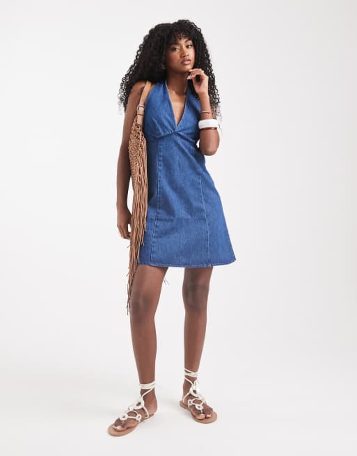 ASOS DESIGN denim halter neck mini dress in mid blue