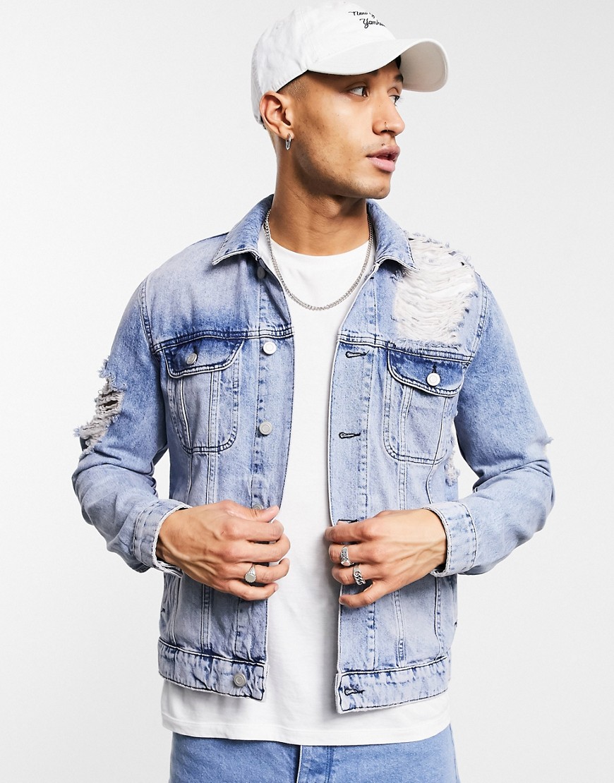 ASOS DESIGN denim jacket with extreme rips in mid wash blue