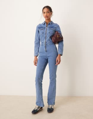 Asos Design Denim Long Sleeve Jumpsuit In Mid Blue