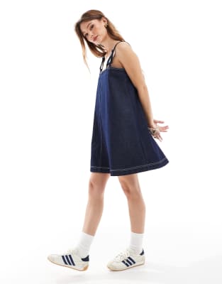 Shop Asos Design Denim Mini Dress With Fisherman Strap-navy