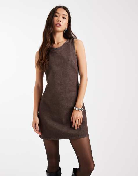 ASOS DESIGN denim mini dress with high-v neck in brown - view 1