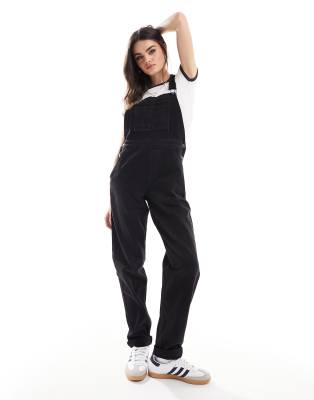 denim overalls in washed black