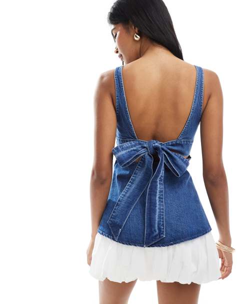 ASOS DESIGN denim peplum top with bow back detail in mid blue - view 1