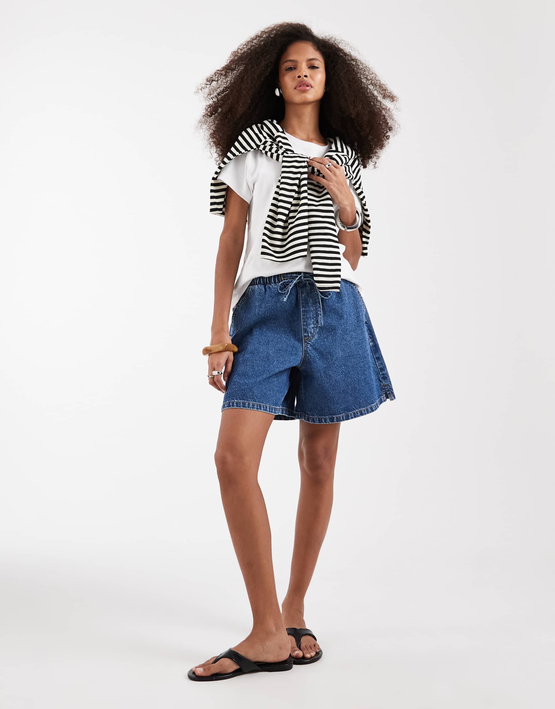 asos design denim pull on longerline shorts in mid blue
