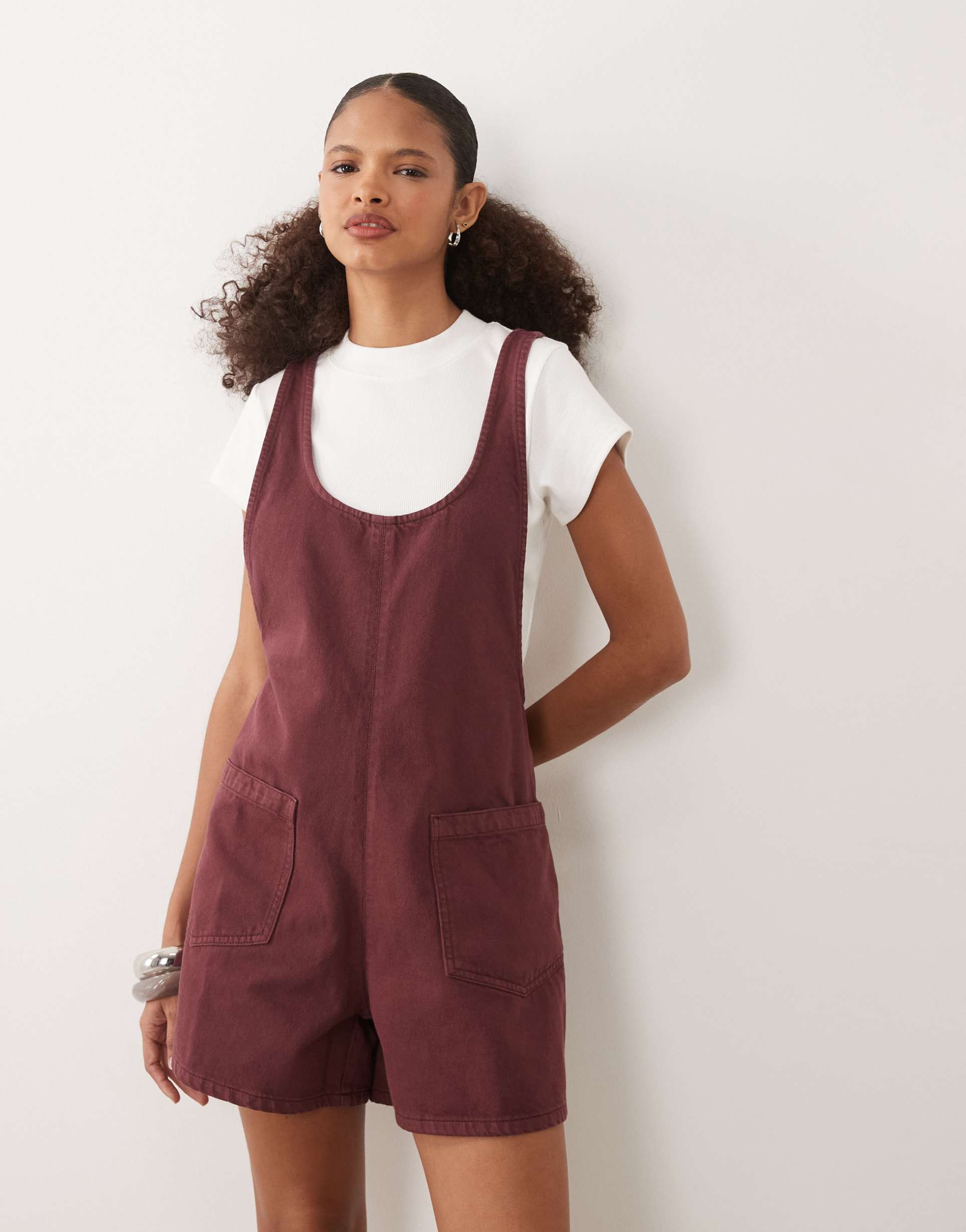 asos design denim romper with scoop neck and cross back in light burgundy