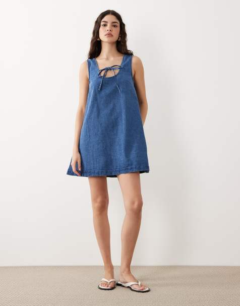 ASOS DESIGN denim scoop mini dress with bow front in light blue - view 1