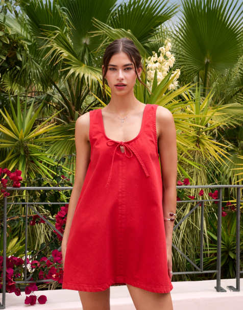 ASOS DESIGN denim scoop mini dress with bow front in red - view 1