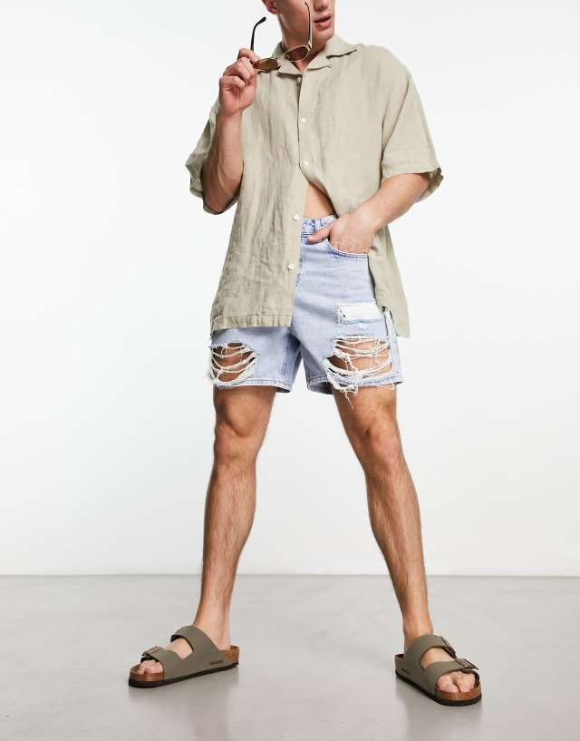 ASOS DESIGN denim shorts in mid wash blue in shorter length with rips