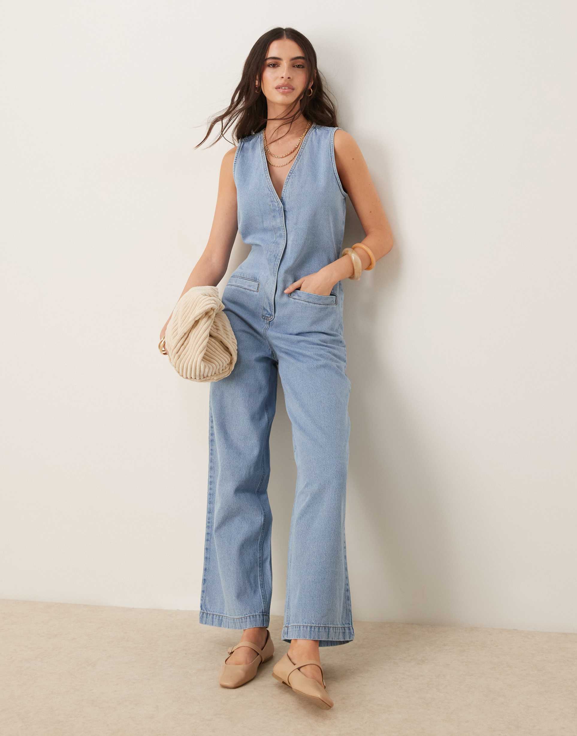 asos design denim sleeveless jumpsuit with tie back in lightwash blue